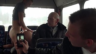 A blonde is getting fucked hard in the bus while people are looking