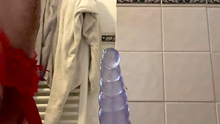 Hot young Femboy in sexy red lingerie shows off ass and plays with favourite toy