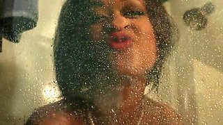 Pornstar Skin Diamond plays with her anal toy in the shower