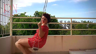 Beutiful lady swinging without panties on a swing outdoors. Slow motion 127 f