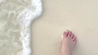 Running my bare feet on the white beach sand by the ocean.