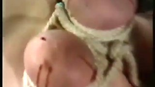 Screaming slave with her tits tied and her nipples b. got a big needle in her clitoris