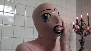 Tanja takes a bath in her latex sex doll costume