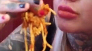 Blonde tattooed milf eats spaghetti on the toilet