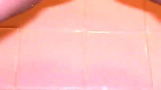 MILF with Pierced Pussy and Big Lips Pissing in Close-up in Her Shower