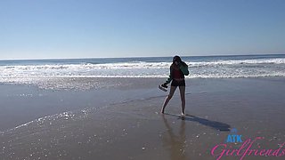 A girl was having fun on the beach with her friend.
