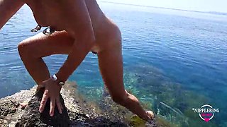 Nippleringlover Extremely pierced nipples and pussy horny MILF swims naked on a public beach