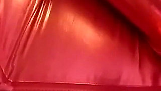 Cougar MILF in a hot red metallic catsuit with huge tits out for play