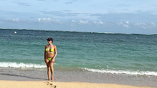 Teasing on the Beach in Micro Bikini on the Sand