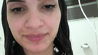 Brunette takes a shower and shaves