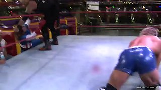 blonde babe fights a guy in a wrestling match