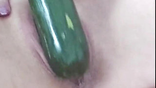 Super horny milf with big clitoris masturbating with a huge cucumber