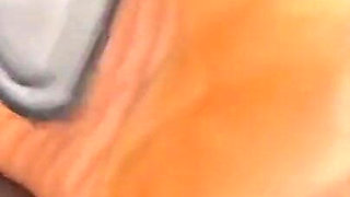 Ebony Girl Gives Her Feet a Massage with a Massage Gun