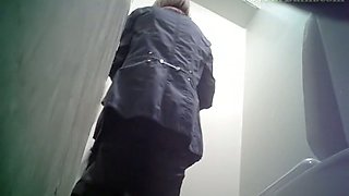 Pale skin blonde lady in the public toilet room recorded on spycam