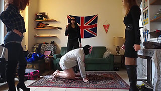 Masked slave gets punished from three femdom chicks