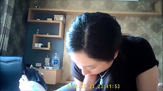 Striking Korean milf gives a nice massage and a hot blowjob