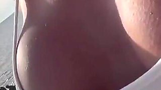 Boobs and Pierced Nipples Playing on the Beach