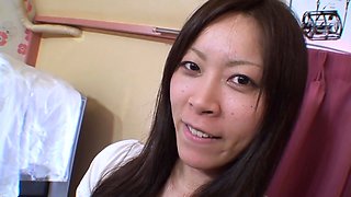 This sexy brunette Asian babe enjoys playing
