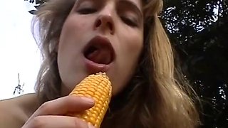 Hot teen girlfriend toying her pussy outdoor with a corn