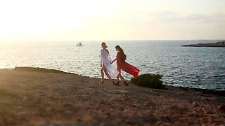 In a kitchen a sexy brunette playing with her big boobs