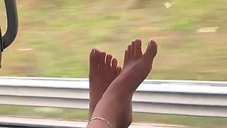 MILF seductress exposing her sexy little feet outdoors