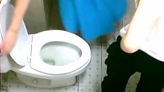 Two cute Asian girls spotted on a toilet cam pissing
