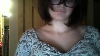 This brunette with glasses shows her big boobs and sucks a