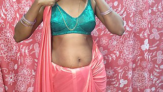 Desi Hot Bhabhiji Wearing Pink Saree in the Bedroom