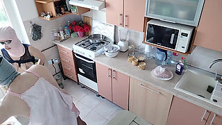 An amateur couple is having fun in the kitchen.