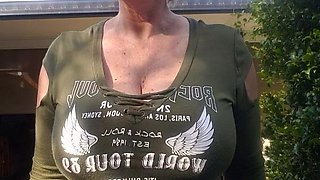 Blonde is flashing her big boobs in the outdoors