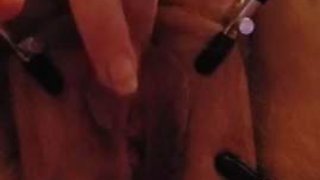 Wife spread with pussy clamps in slow motion