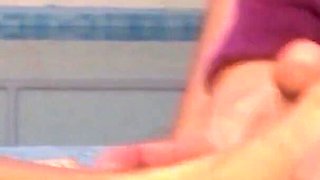 Beautiful blonde by the pool fucks a stranger's willing cock with her feet