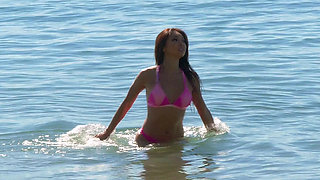 Busty Asian Ayumi Anime solo fucks herself on the beach