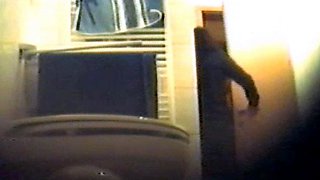 Girl using the toilet and filmed by voyeur 2