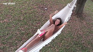 Sex-hungry hottie Maria Rya is playing with her pussy in a hammock