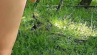 Beautiful Woman Undressing and Walking Nude with a Clit Pump Outdoors in a Public Forest