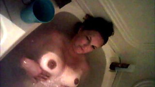 Wife rubbing tits in bathtub
