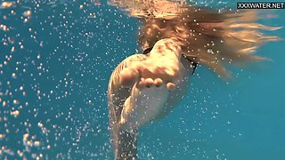 Perfect body blonde teen enjoys naked swimming