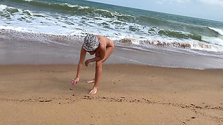 A Busty Blonde Is Walking and Sunbathing Naked