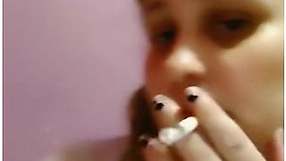 Pink braids and a cigarette in slow seduction