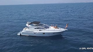 Alluring brunette explores passionate lesbian threesome with intense beach boat desire