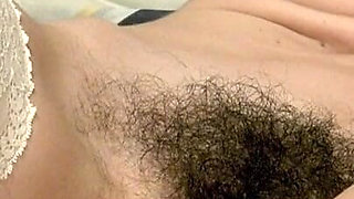 Hot milf with perfect hairy pussy masturbates to squirt orgasm