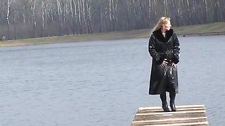 Bitch in leather pissing on a pier