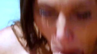 Two brown-haired dolls give a man blowjob