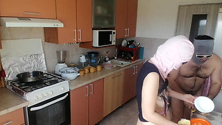 Amateur couple cooks naked in the kitchen