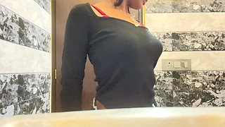 Sexy babe showing her boobs in bathroom