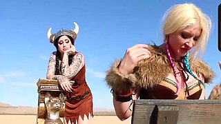 Two costumed ladies with huge hooters play in the