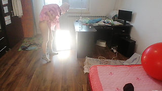 Sexy brunette doing naked chores around the house.