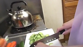 Insatiable Young Wife Drenches Cucumber Deep in Kitchen Sink