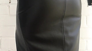 Check Out My Black Shoes, Fishnet Tights, Form-fitting Leather Skirt, and Sexy Leather Jacket